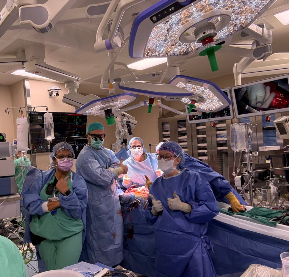 Dr. Allan Stewart with a surgical team in the operating room
